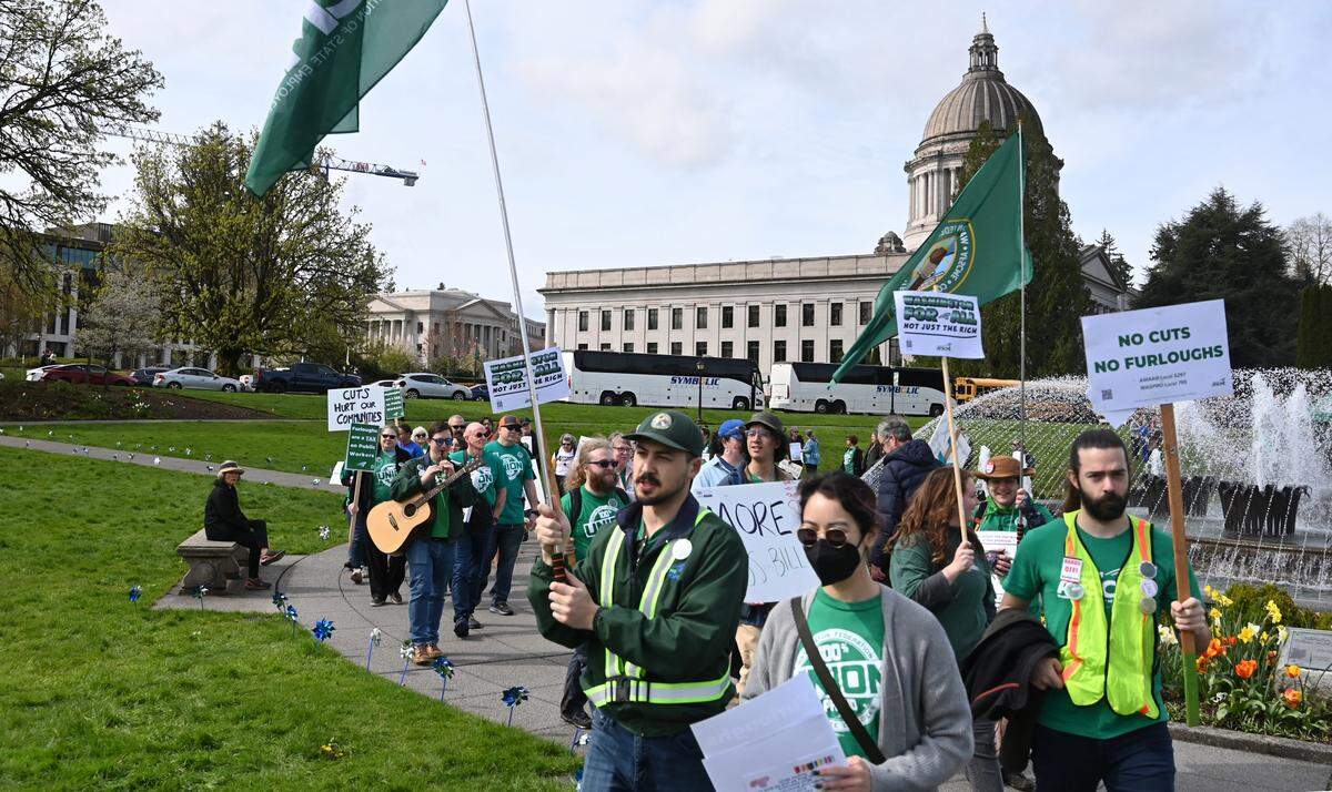 Dozens of members with the Washington Federation of State Employees gathered at the Tivoli Fountain on the Capitol campus in Olympia, Wa. for a rally and march in opposition to potential cuts and furloughs being proposed during the 2025 legislative session.