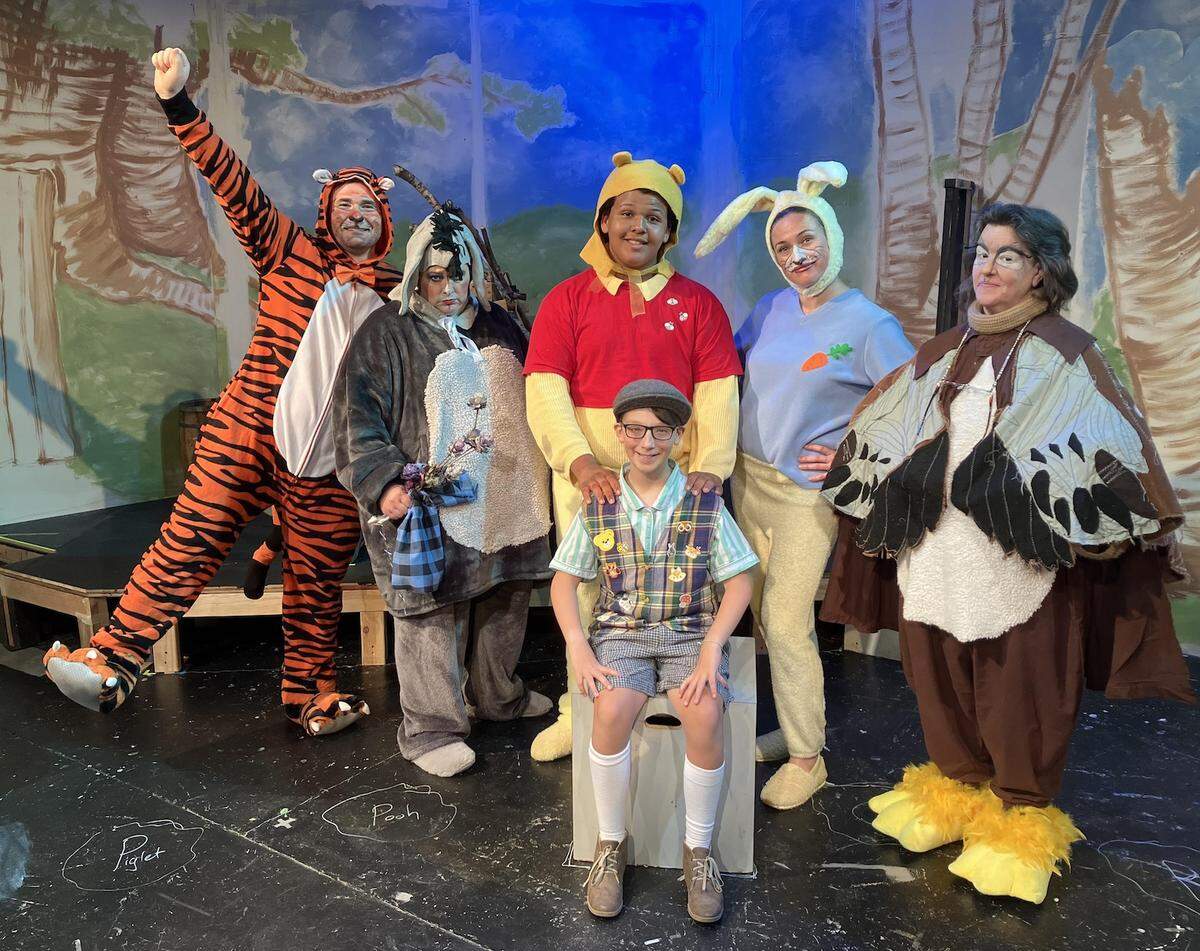 Olympia Family Theater’s “The House at Pooh Corner” brings together Christopher Robin (Hudson Ray, front and center) and his friends in the Hundred-Acre Wood, from left, Tigger (Jerry Romasco), Eeyore (Christine Goode), Winnie the Pooh (Isaiah Myers), Rabbit (Katie Wiggett) and Owl (Debbie Sampson).