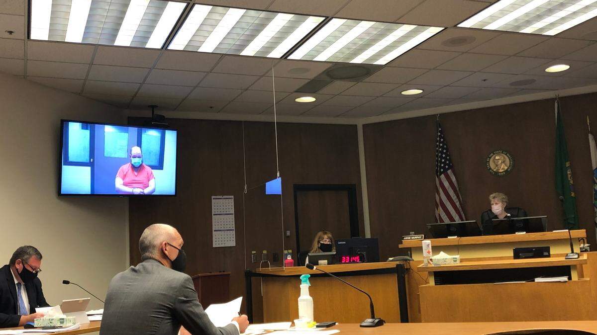 Seed was arrested Thursday after he allegedly aimed a gun at a shopper who had asked him to put on a mask inside Tumwater's Fred Meyer.