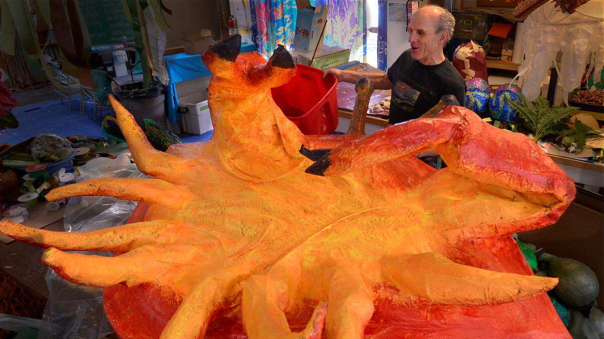 Talk about a King Crab! Procession of the Species founder Eli Sterling holds a large likeness which will be present at the annual Illuminated Ball. Saturday evening at the Eagles Ballroom in Olympia. The event is the annual fundraiser for the Procession of the Species and its Community Art Studio.