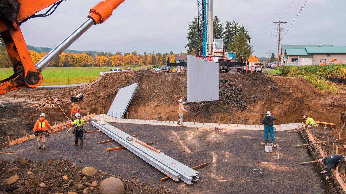 Crews stage components of a bridge on a work site at 175 Howanut Road in Oakville Friday morning.