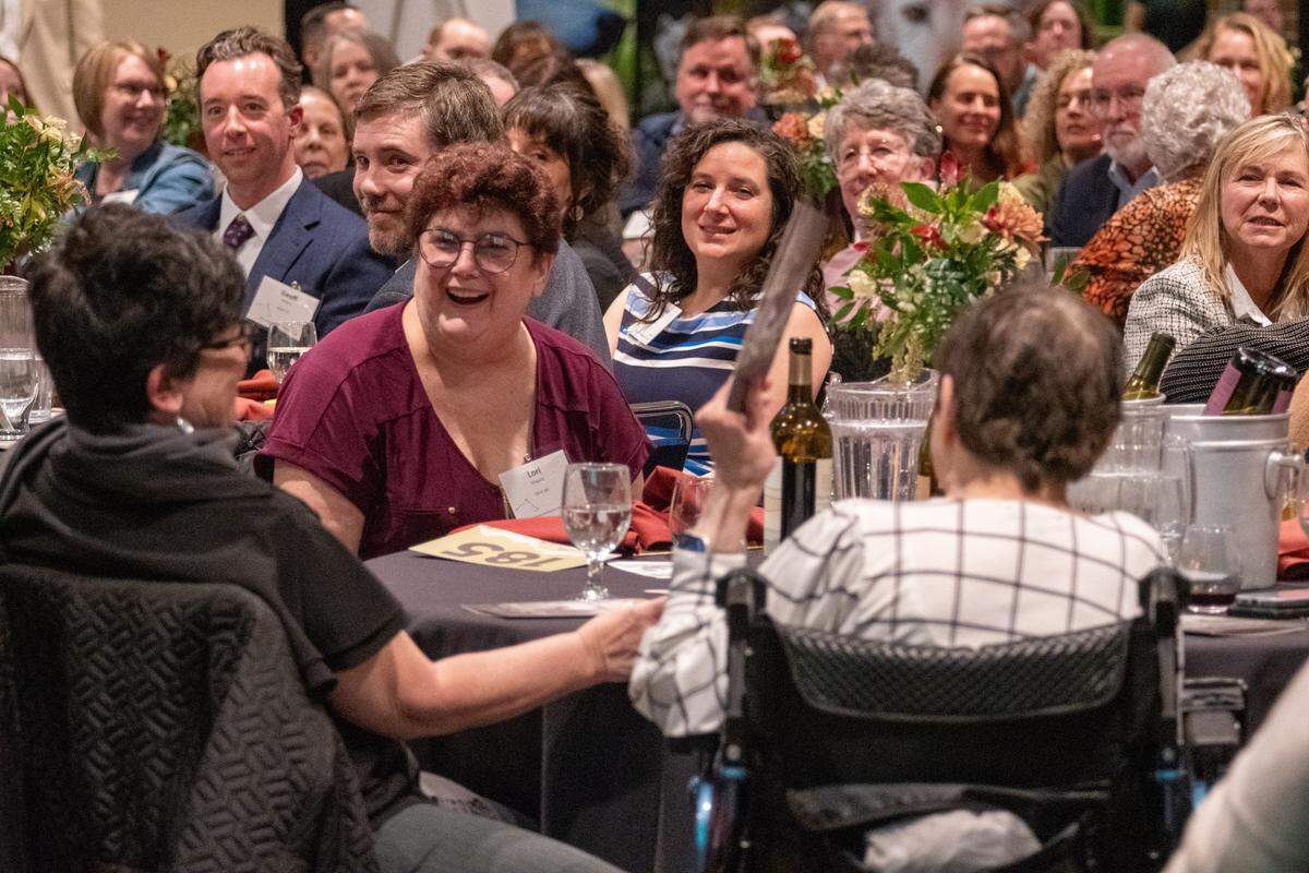 A photo of those who gathered for a recent Wolves & Wine fundraiser.