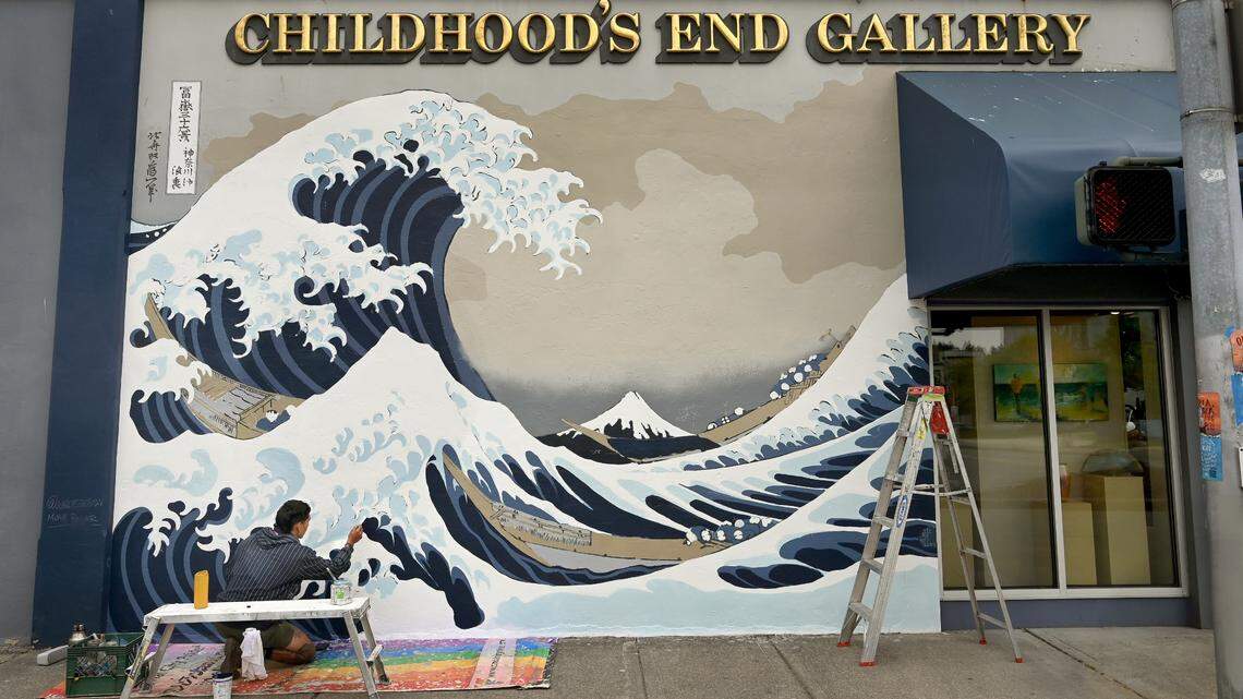Old painting, new strokes: Local artists restore downtown Olympia’s ‘Great Wave’ mural