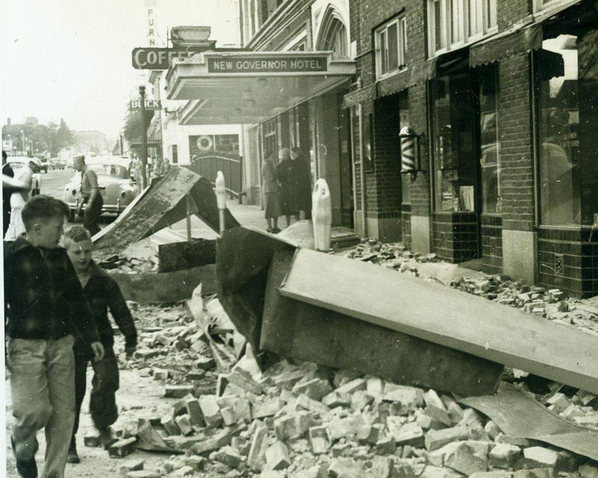 Rubble on the sidewalk outside the New Governor Hotel in downtown Olympia following the 1949 earthquake.