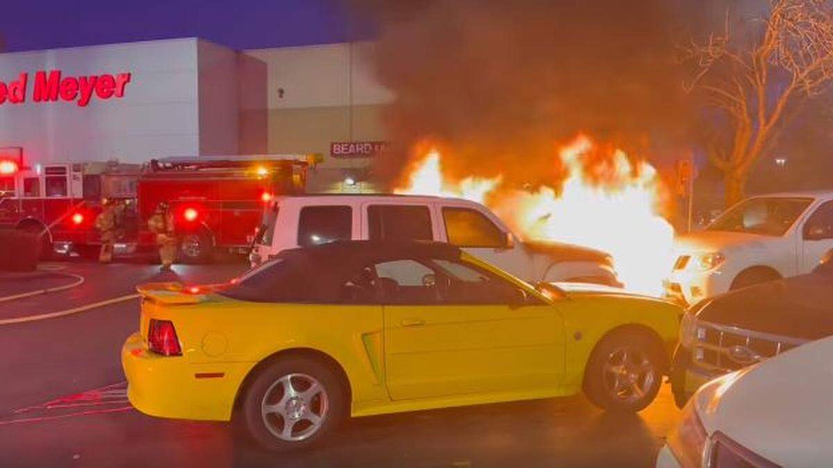 A vehicle fire spread to a second vehicle in the Fred Meyer parking lot in Lacey about 5 p.m. Saturday, according to Lacey Fire District 3.