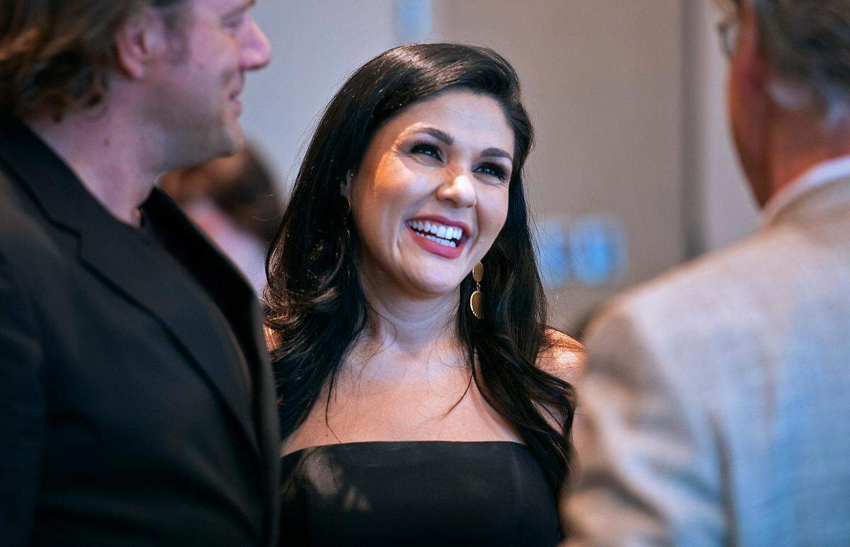 Alexandra Arrieche is congratulated after being announced as the new music director for the Olympia Symphony Orchestra during their fundraising gala at Indian Summer Golf & Country Club in Olympia, Washington on Friday, June 24, 2022.