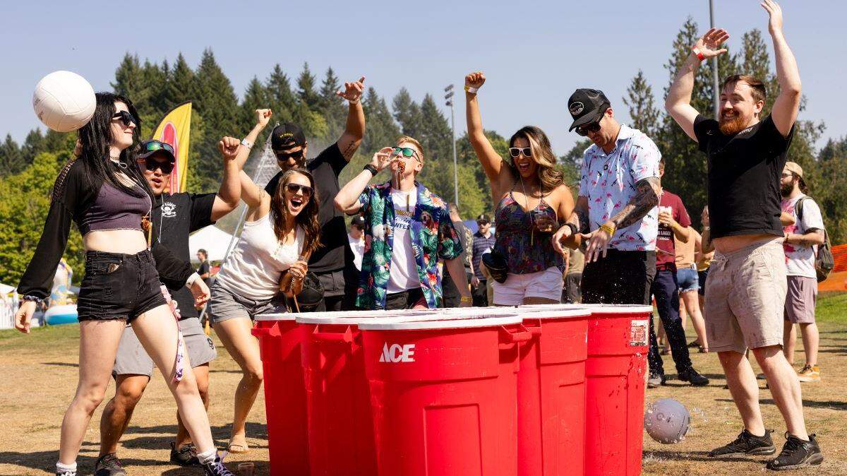 Revelers play giant beer pong at Tumwater Artesian Brewfest.