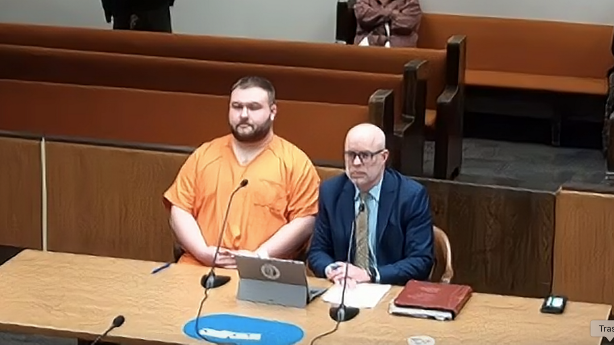 Taylor Beau Hendershot (left), a 30-year-old Thurston County Sheriff’s Office corrections sergeant, sits next to Thurston County Public Defense Director Patrick O’Connor during his preliminary appearance in Thurston County Superior Court on Tuesday, May 20, 2025. Hendershot is accused of first-degree voyeurism.