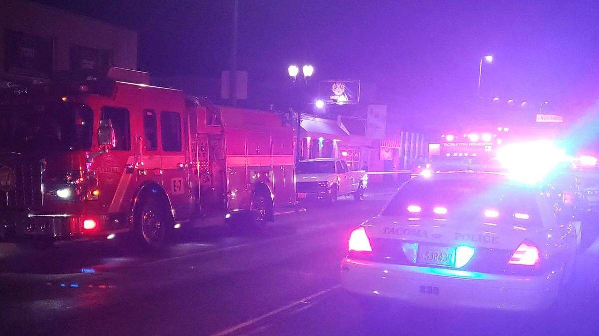 The man was shot multiple times in the chest and died at the scene while being treated for his injuries, according to the Tacoma Police Department.