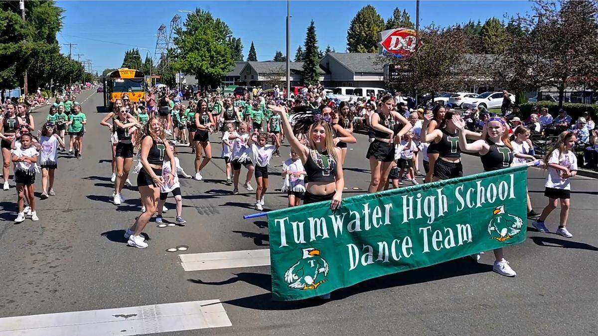 The Tumwater High School Dance Team is welcomed by throngs of spectators lining Capitol Boulevard for Tumwater’s 36th Annual Independence Day Parade in 2024. The July 4 parade includes music, muscle cars, dance troupes and more.