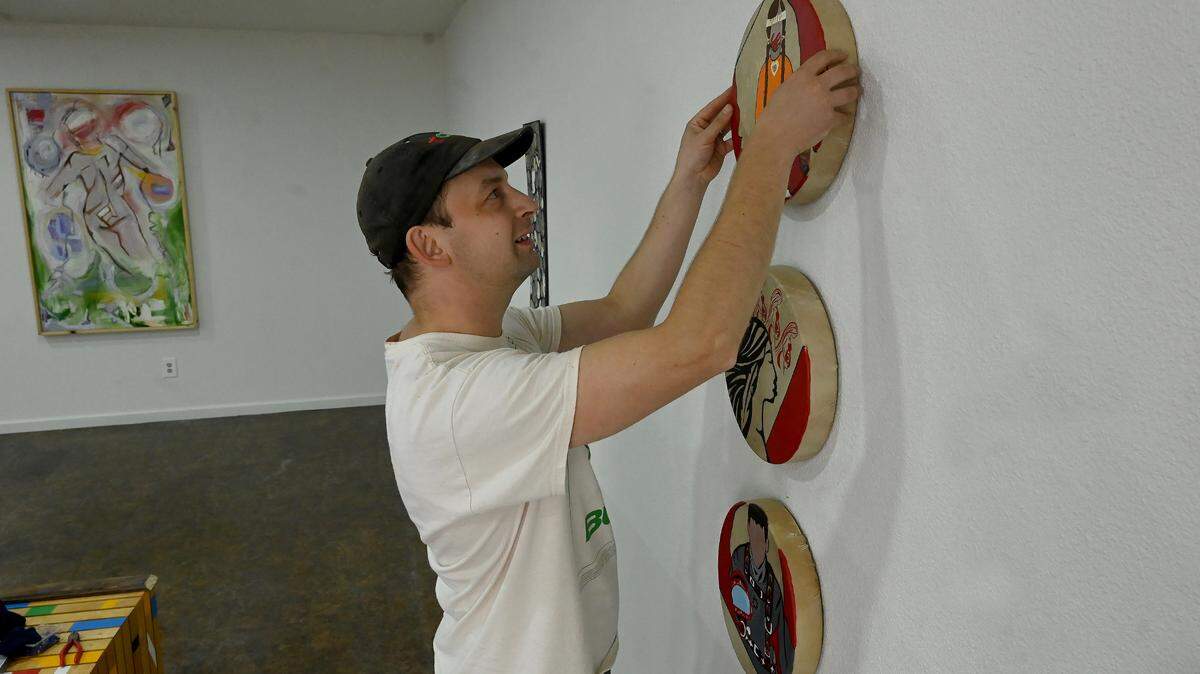 Dave Hoekje finishes the gallery installation Wednesday for the Thurston County Museum of Fine Arts’ second annual Coast Salish Museum of Fine Arts as part of the 2024 fall Arts Walk weekend in downtown Olympia. Arts Walk returns this weekend, Oct. 3-4.