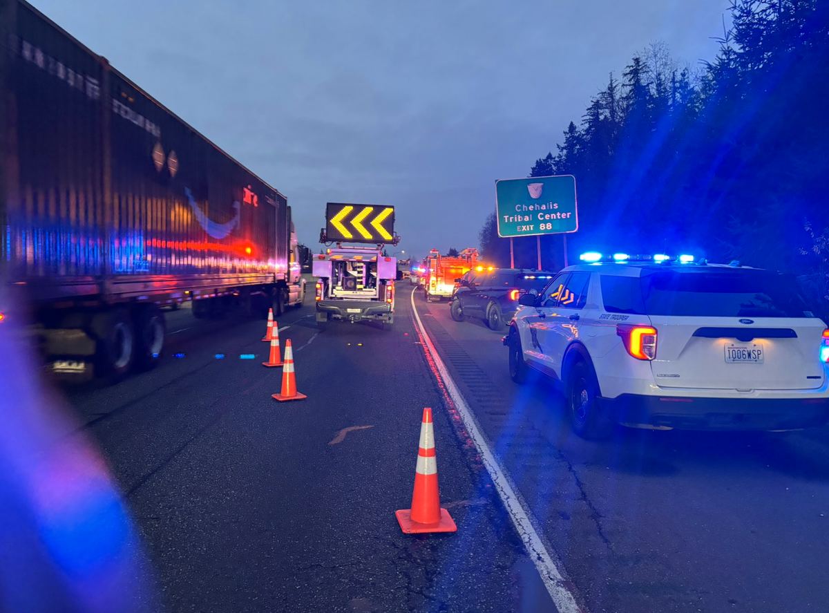 Washington state troopers and Department of Transportation crews diverted traffic from the right lane of northbound I-5 near Grand Mound on Wednesday, Dec. 3, 2025. The lane was cleared so troopers could investigate the scene of fiery car wreck where one person was pronounced dead.