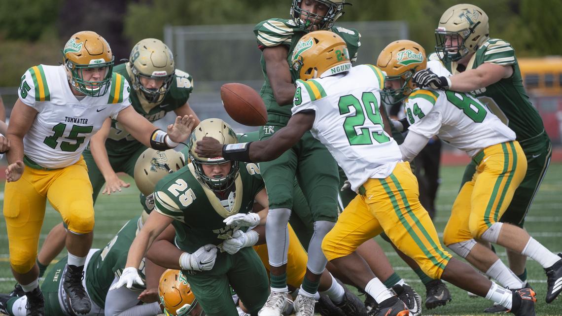 
Timberline running back Jaden Gorman has the football jarred loose by Tumwater defender Jacob Schuster during Friday night’s season-opening game at South Sound Stadium in Lacey. Tumwater recovered the fumble – one of several early turnovers for the Blazers.
