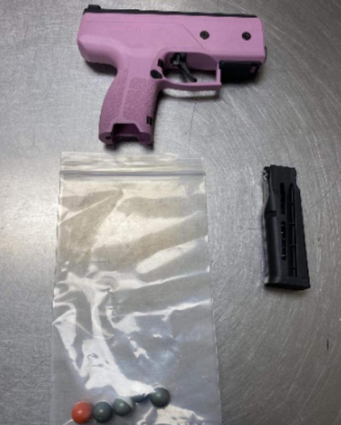 An 18-year-old was arrested in Olympia after a video showed her assaulting a 16-year-old at a Pear Street NE party and using a pink pepper-ball gun.