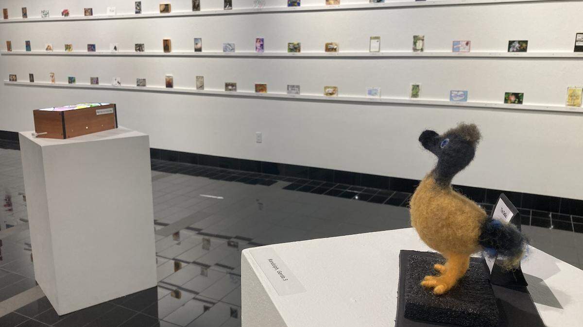 Gerda Randolph’s three-dimensional wool felt dodo bird stands among the 139 postcard-sized works by local artists on display at SPSCC’s Leonor R. Fuller Gallery.