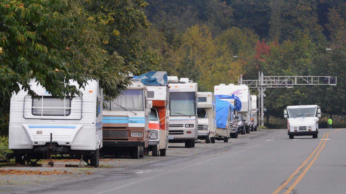 RVs parked along Deschutes Parkway near Capitol Lake in Olympia.