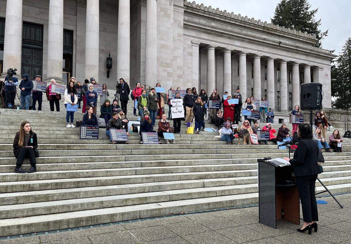 Abortion rights activists rally outside Washington’s Legislative Building in Olympia on Tuesday as Senate committees heard testimony on a package of bills aimed at protecting reproductive rights.