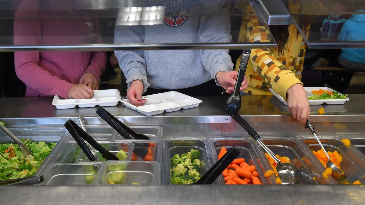 Students pick their lunch at Lacey’s Chinook Middle School on Tuesday.
