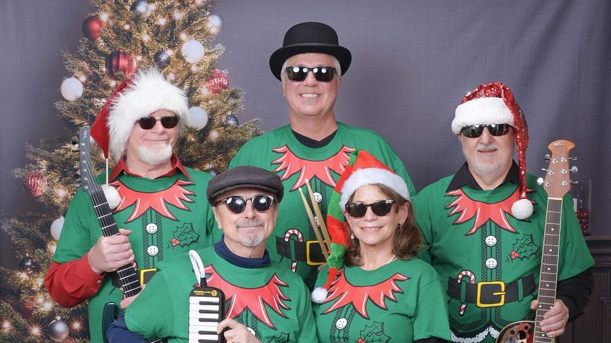 The True Olympians — back row from left, Tom Dyer, Michael Stein and Gene Tveden, and front row, Joe Cason and Lisa Ceazan — will be sharing their Christmas repertoire Dec. 23 in Tacoma.