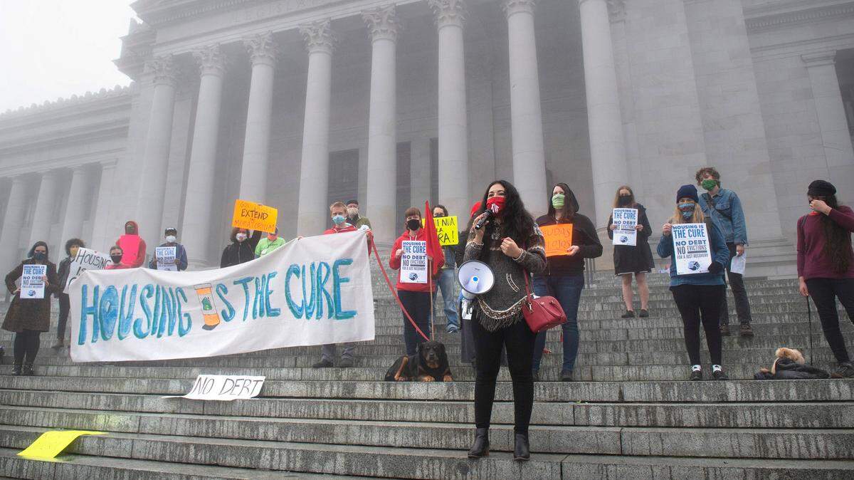 Julissa Sanchez of the Tenants Union of Washington addresses tenant advocates as they ally for an extention of the COVID-19 eviction moratorium on the steps of the Capitol in Olympia, Washington, on Friday, Oct. 2, 2020.