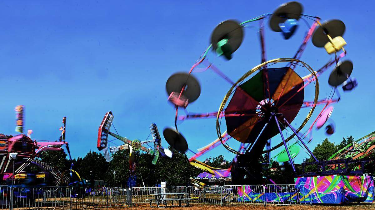 Funtastic Traveling Shows Carnival fire up their aerial rides for a test run on Tuesday, July 16, as they prepare for opening day of the annual Capital Lakefair along Capitol Lake. The festival kicks off at noon on Wednesday.