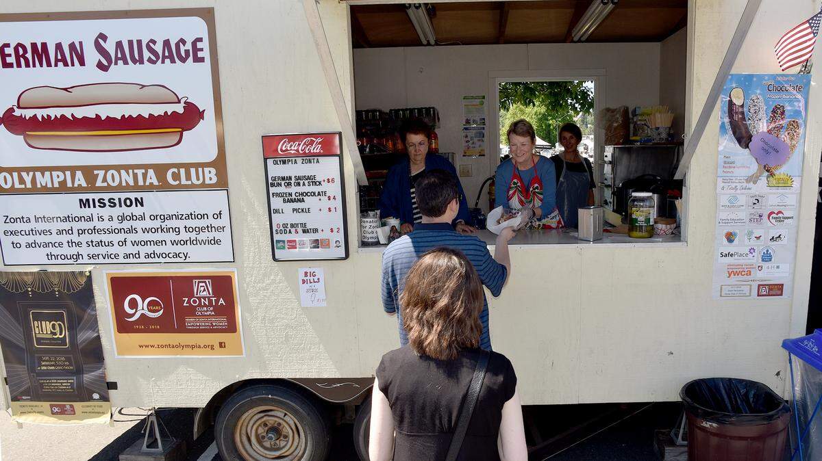 Lunchtime lines are steady at the Olympia Zonta Club’s food booth on opening day of 2018 Capital Lakefair.