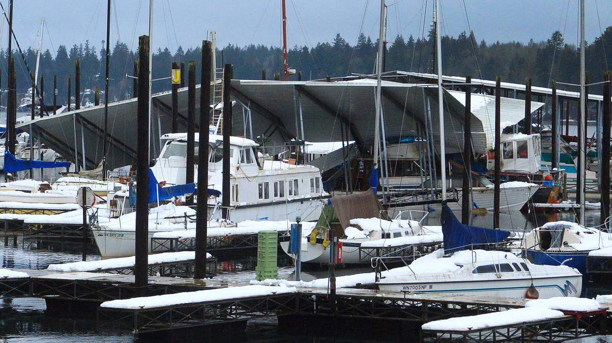 A roof at the West Bay Marina in Olympia collapsed, sinking three moored boats.