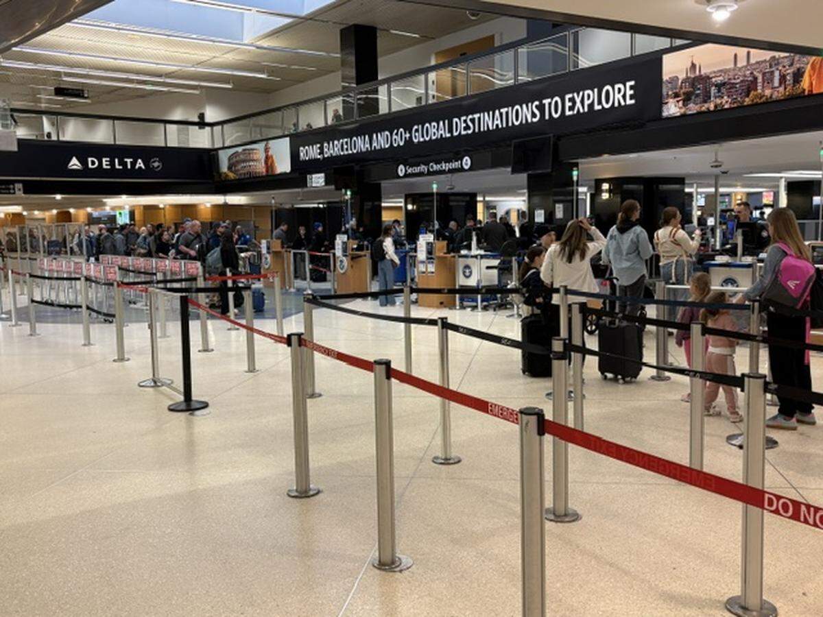 Travelers arrive at a checkpoint at the Seattle-Tacoma International Airport on Wednesday, March 25, 2026.