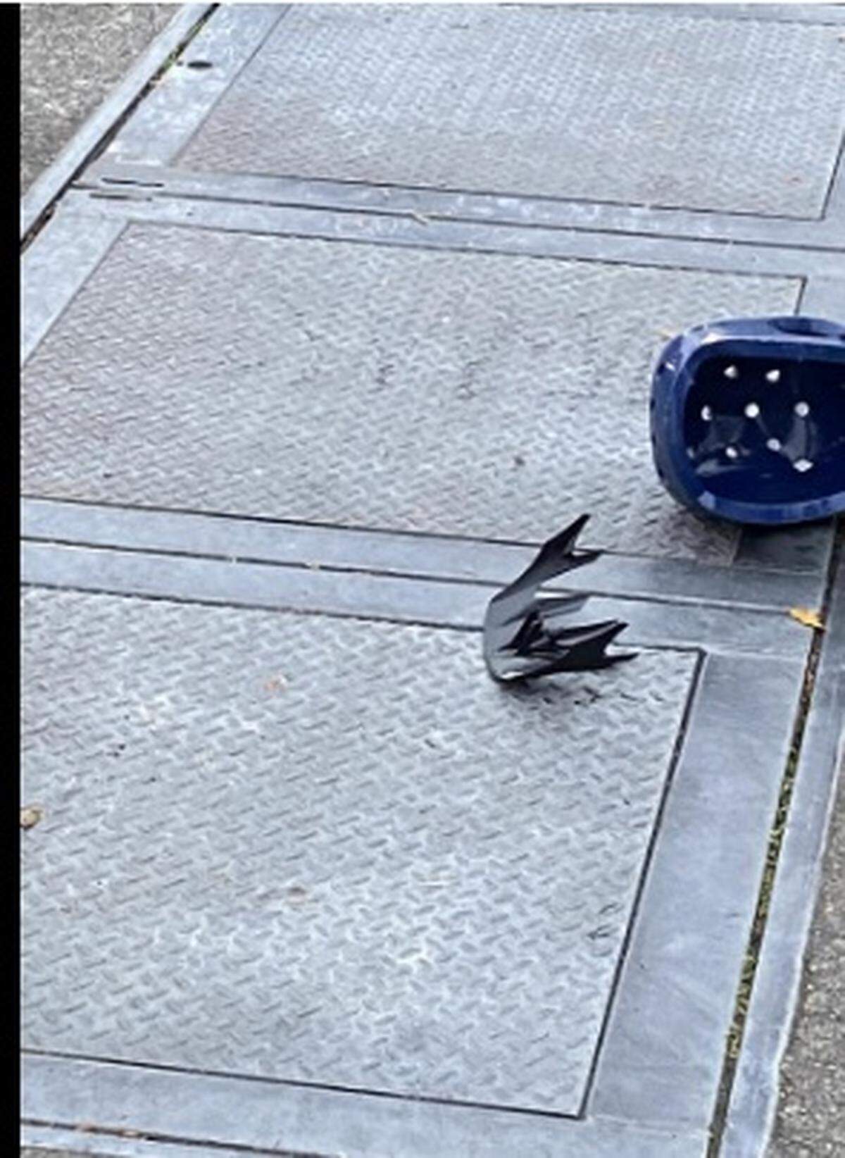 A photo of a helmet and broken visor is shown on the ground after a member of Olympia police’s walking patrol was assaulted downtown on Dec. 2.