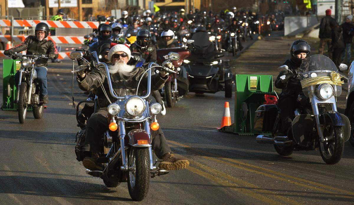 The roar of thousands of motorcycles echoed through the streets of downtown Olympia on Saturday, Dec 3, 2022, for the annual Olympia Toy Run. Gathering earlier in the morning at the South Sound Mall in Lacey, they all set off for a 1 p.m. parade to Marathon Park along Capitol Lake to deliver thousand of presents for the Olympia Corps Salvation Army's “Toy n Joy” program.