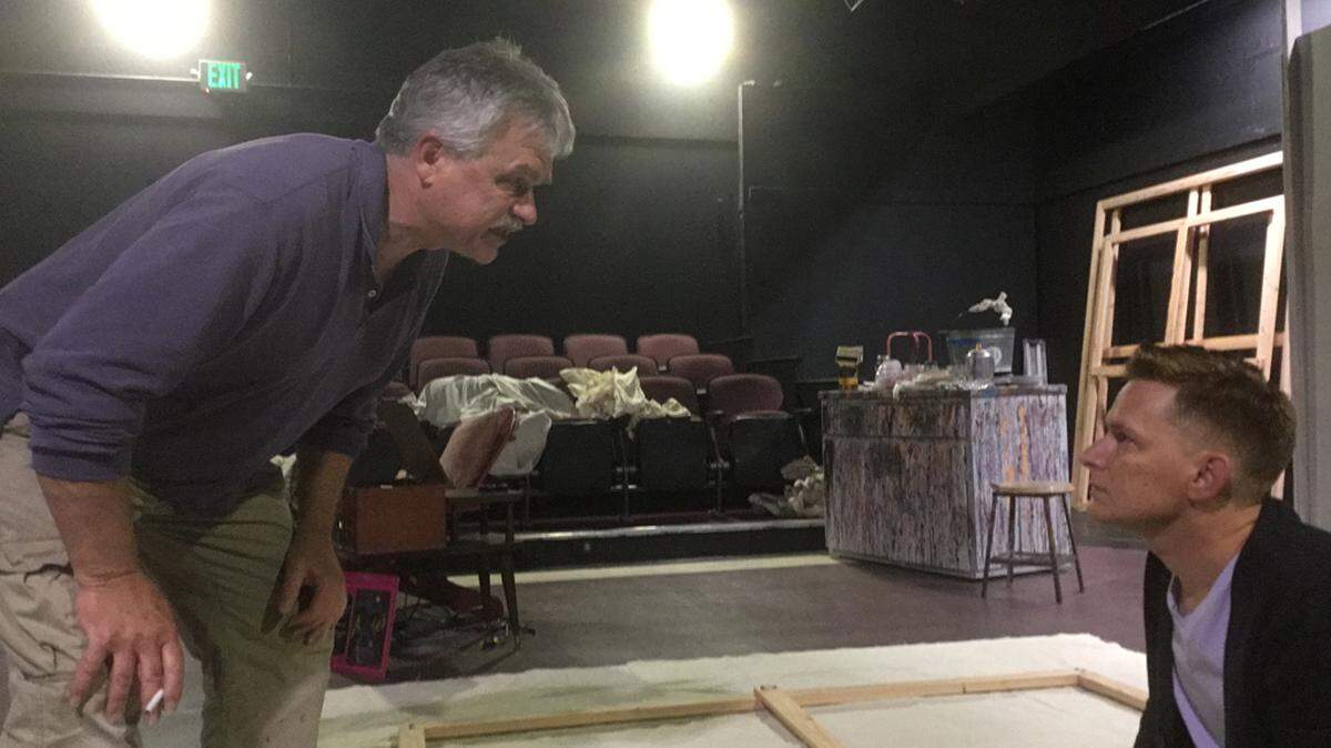 Christopher Valcho as Mark Rothko and John Tuttle as Ken, Rothko’s assistant, in the Olympia Little Theater’s production of “Red.”