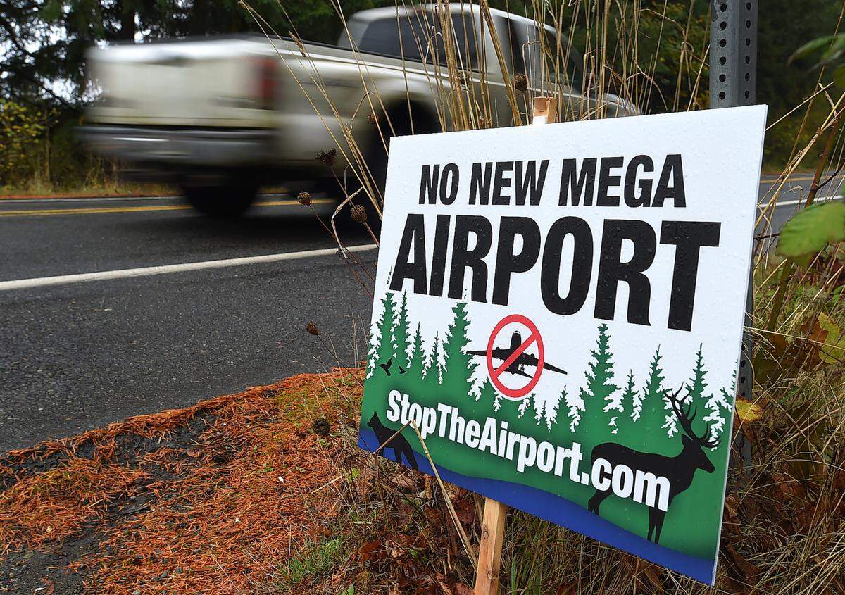 A “No New Mega Airport” sign posted at the intersection of Rainier Road and Trowbridge Avenue Southeast on Nov. 2, 2022.