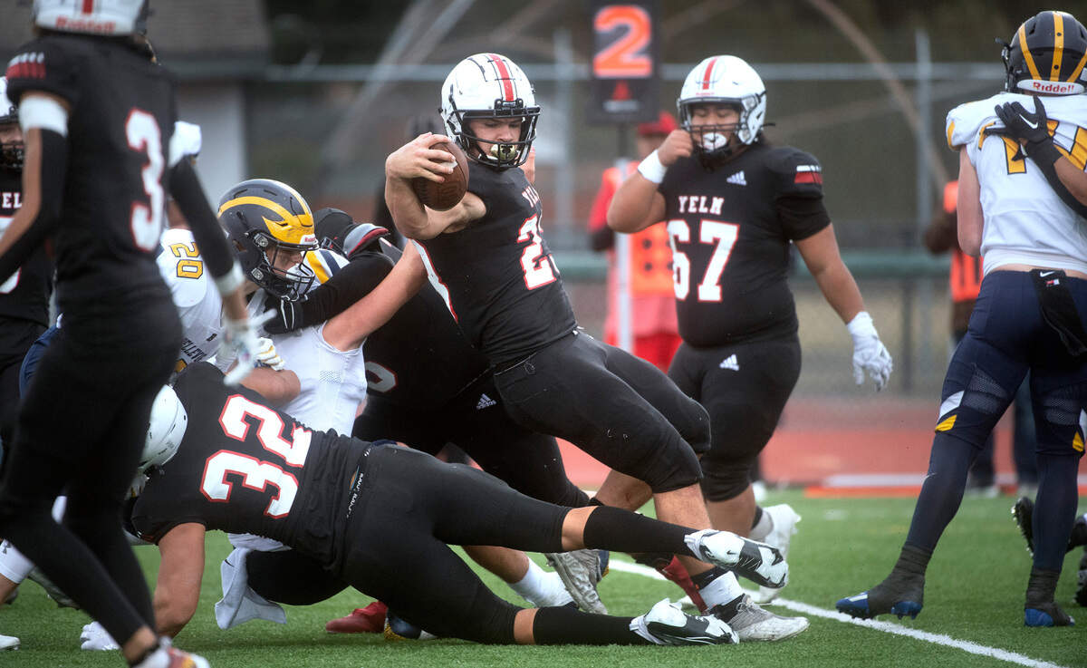 Yelm running back Brayden Platt spins into the end zone for a touchdown during the Tornados’ 28-27 victory over the Bellevue Wolverines in Saturday afternoon’s 3A football state semifinal game at Art Crate Field in Spanaway, Washington, on Nov. 26, 2022.
