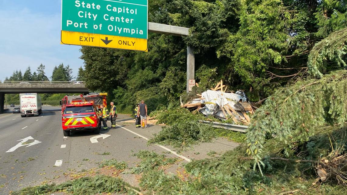 I-5 exit to Olympia blocked after suspected DUI driver struck tree, dumped lumber load