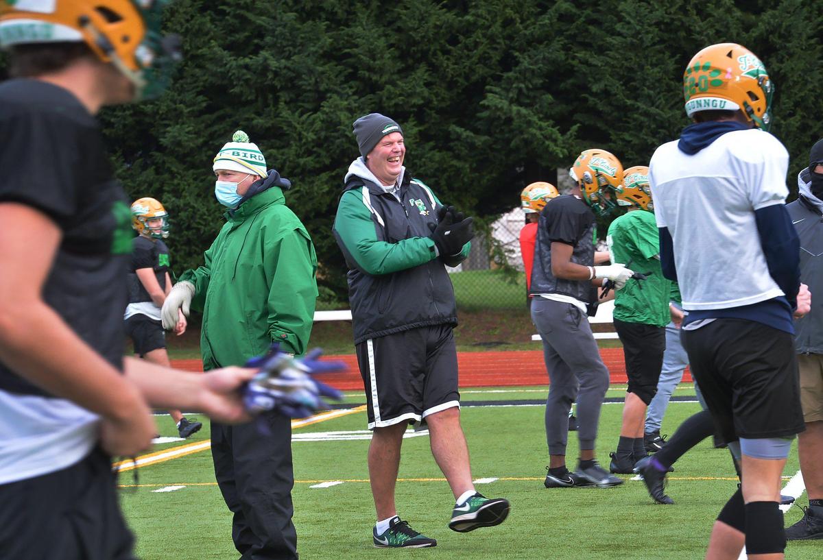 T-BirdsÕ head football coach Bill Beattie enjoys a light-hearted joke at the expense of one of his assistant coaches during the T-BirdsÕ pre-Thanksgiving practice on Nov. 24.