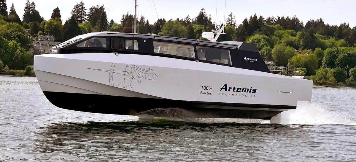 The Artemis EF-12 Escape Water Taxi makes an at-speed parade pass along the Port Plaza dock in Olympia on May 8 during a demonstration in front of Port and city of Olympia officials.