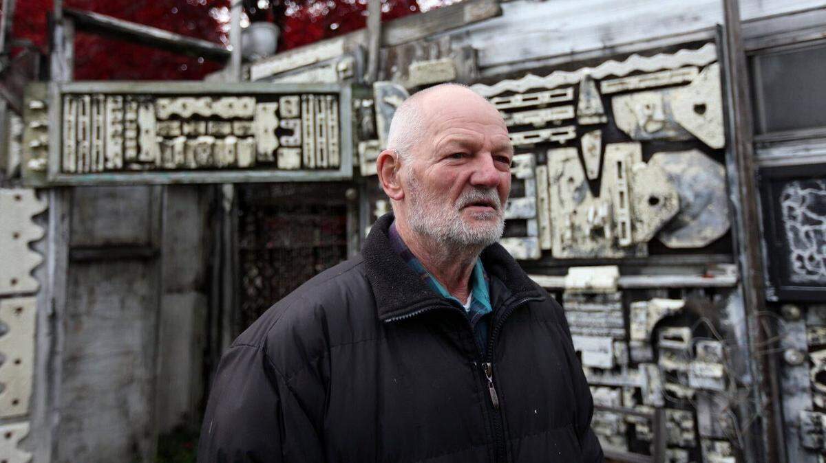 Artist Richard Tracy stands amid his famous “Art Farm” in the yard at his home on Harrison Avenue in Centralia.