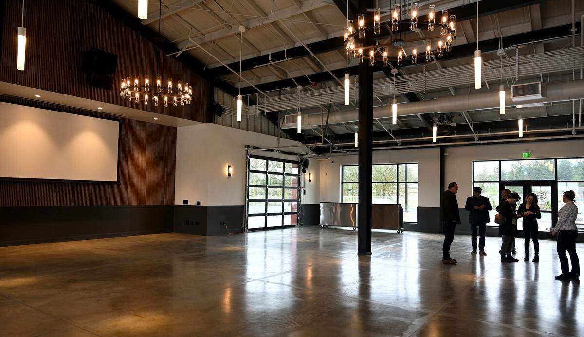 A group gathers in the Stone City Event Center posted in the Southwest Washington Regional Agricultural Business & Innovation Park on March, 28.2025. Located on a 13-acre site in Tenino, Wa. the complex will house a variety of agriculture and food based businesses along with the Stone City Event Center, a public meeting venue which features state of the art audio and visual technologies shown here.