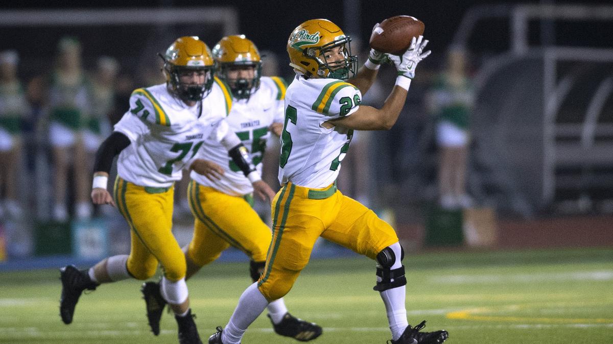 Tumwater running back Rico Spriegner pulls down a pass reception during Friday night’s Pioneer Bow football game against the Black Hills Wolves at Tumwater Stadium on Oct. 19, 2018.