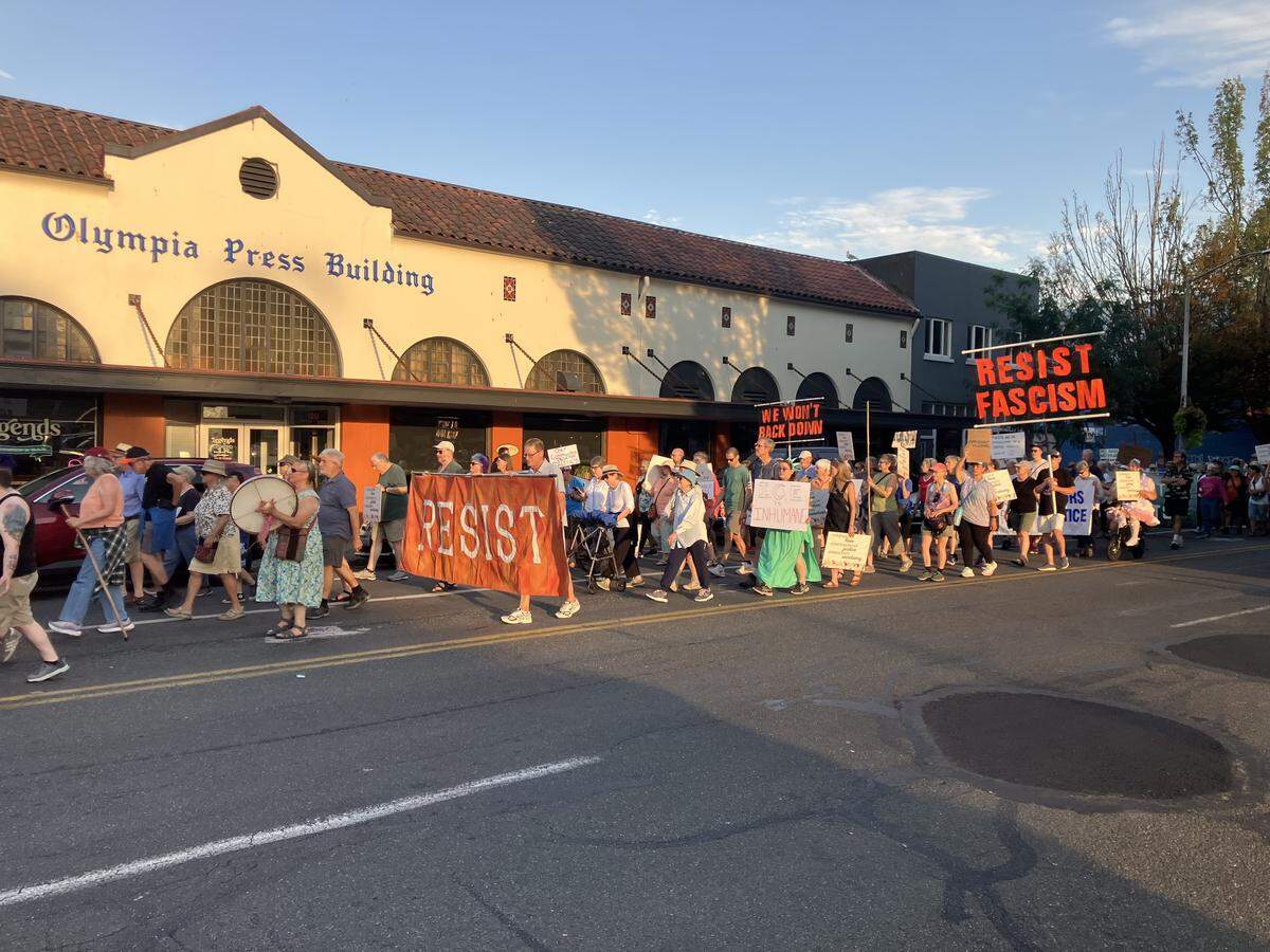About 300 people marched north on Capitol Way Saturday evening, then turned left onto Olympia Avenue and finally gathered at Percival Landing Park to show support for immigrant rights.