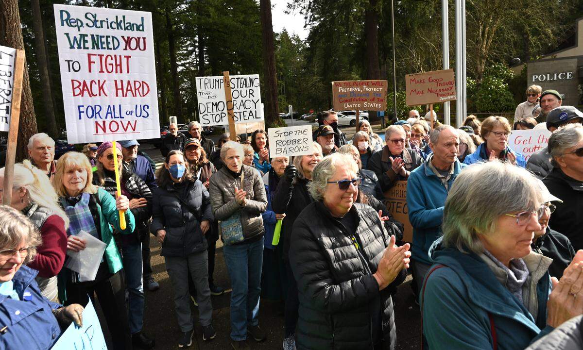 Local people opposed to the Trump administration made their voices heard Tuesday morning when about 100 people gathered outside the Lacey City Hall-based offices of Congresswoman Marilyn Strickland.