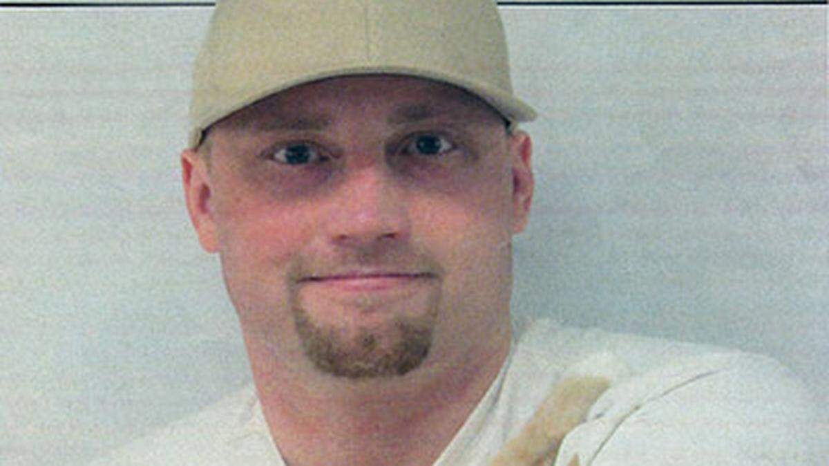 Daniel J. Simms holds his rescue cat “Sketch” in a photo taken at the Clallam Bay Correctional Center in Dec. 2021.