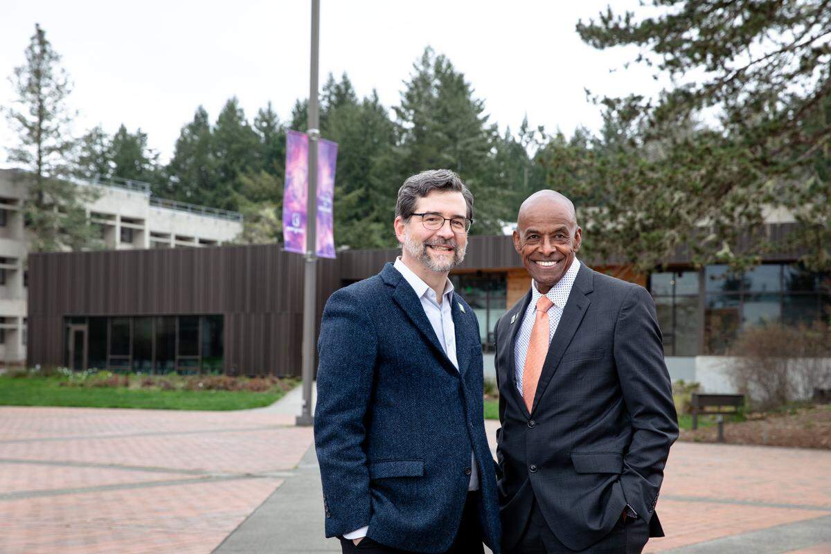 President John Carmichael (left) and Executive Vice President Dexter Gordon on Red Square at The Evergreen State College In Olympia. “It is clear that the two of them are working very well together and providing forward-oriented leadership for Evergreen,” Board of Trustees chairwoman Karen Fraser said Thursday, July 7, 2022.