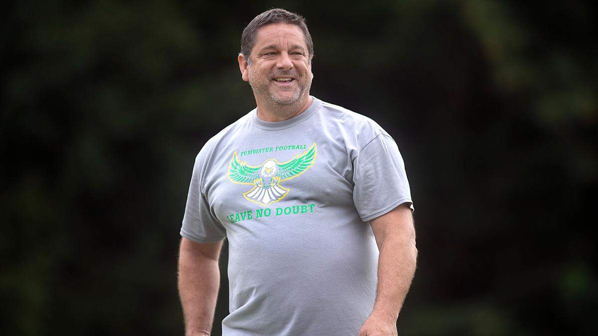 Tumwater defensive coordinator Tim Otton watches over the T-Birds during football practice on Sid Otton Field at Tumwater District Stadium in Tumwater, Washington on Friday, Aug. 19, 2022.