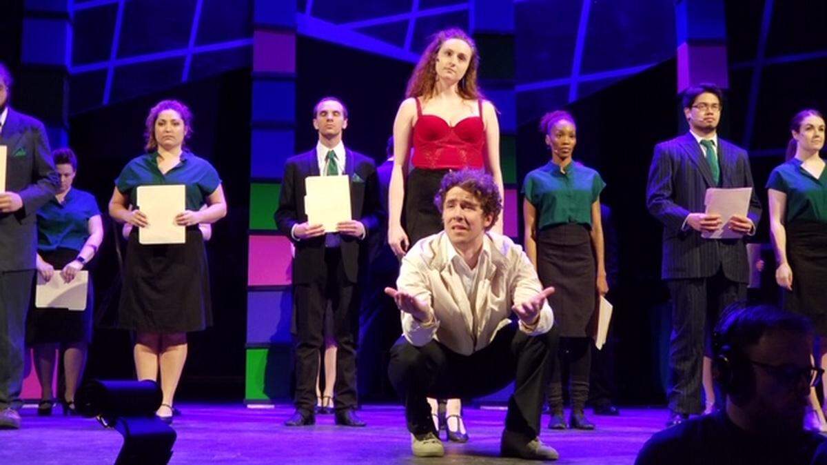 The cast, led by Jake Atwood as Robbie Hart, rehearses for the opening of “The Wedding Singer” Friday at the Capitol Theater.