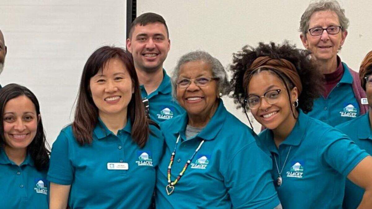 Commissioner Annie Clay (back row, far right) and the rest of the Lacey Equity Commission. They are set to host their next community forum on July 12.