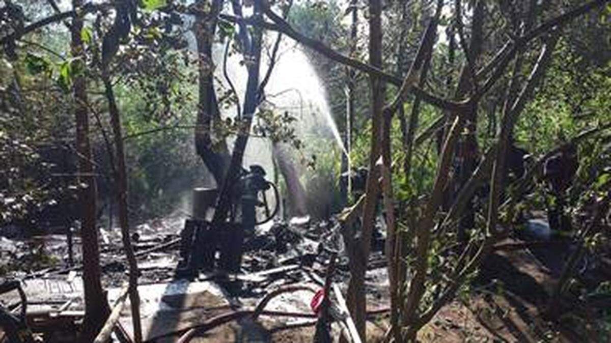 Friday’s fire burned two dead trees and a wooden shelter at a homeless camp near Pacific Avenue Southeast. Crews were able to put out the fire before it could spread to trees surrounding the camp.