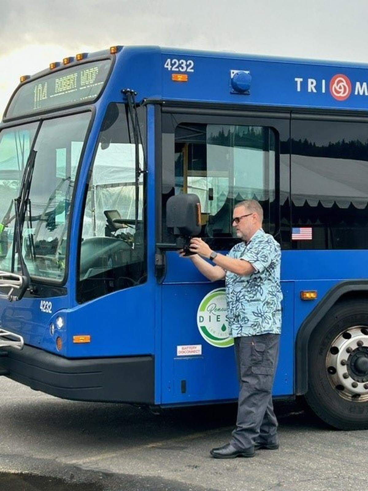 Intercity City bus operator Rob Wood checks a side mirror during a “roadeo” competition in Portland, Oregon. He won first place.