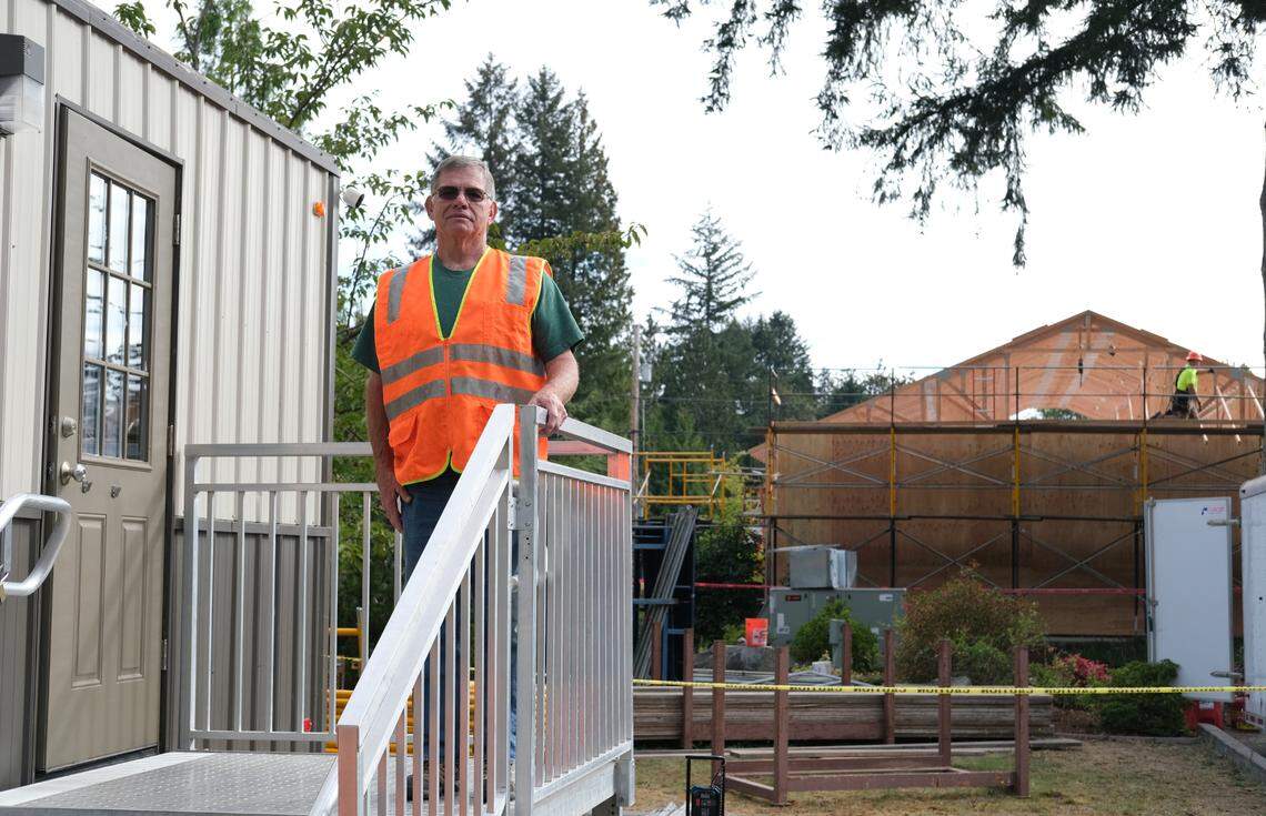 Randy Sweet, 65, stands at the construction site of a new Jehovah’s Witnesses Kingdom Hall in Olympia. Sweet volunteered in a security role.
