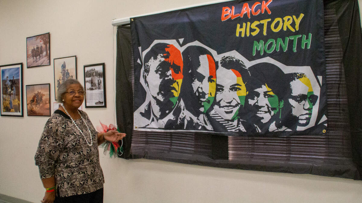 Dr. Thelma Jackson walks through the Black History Museum that was set up in the New Life Baptist Church in Lacey. The museum was opened to the public Feb. 18, and 165 people visited. The church also hosted a Black History panel discussion.